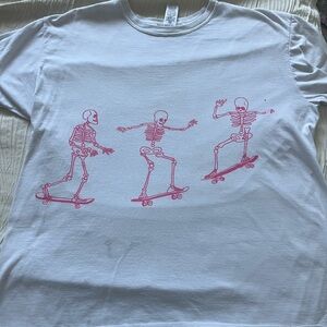 White T-Shirt with Pink Skeleton Skateboard Print